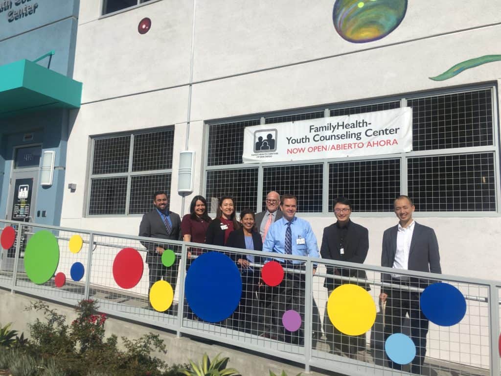 Gabe V. (far left) and Chris H. (far right) with the FHCSD staff and Janine Pairis Bryant from Rep. Vargas’ office