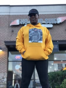 Kartisha Henry standing in front of Wing Suite